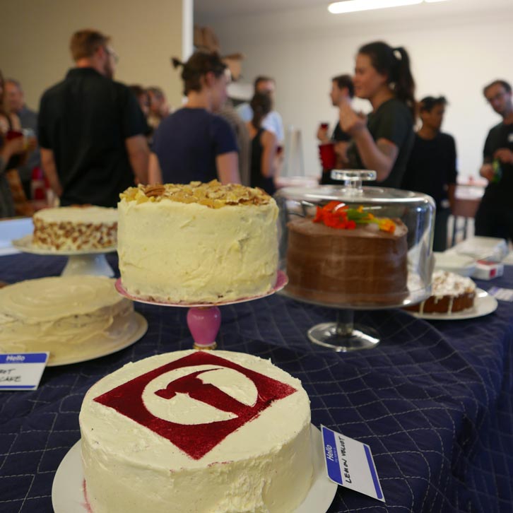 Lemon meringue, hummingbird, cheesecake - the impressive assortment of homemade cakes relfected the impressive assortment of attendees. Old time JAS clients, buff construction workers, and peers in the industry all gathered around converted saw table tops. Everyone came together to share food, fun, and of course to soak up the wisdom from the special guest speaker - Andrew Freear.