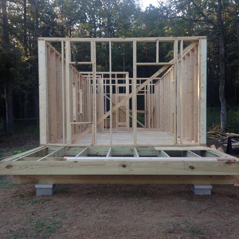 The cohesion of our team was evident as we maneuvered efficiently across the site gauging, measuring, cutting and nailing each piece of lumber as if the wood was cultivated for that particular purpose. In the end, a house with metal roof, siding and windows stood after twelve very hot and productive construction days.